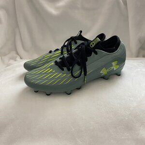 The Under Armour Youth Magnetico Select 4 FG JR Cleats in Green